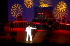 Live stage performance with theatrical lighting
